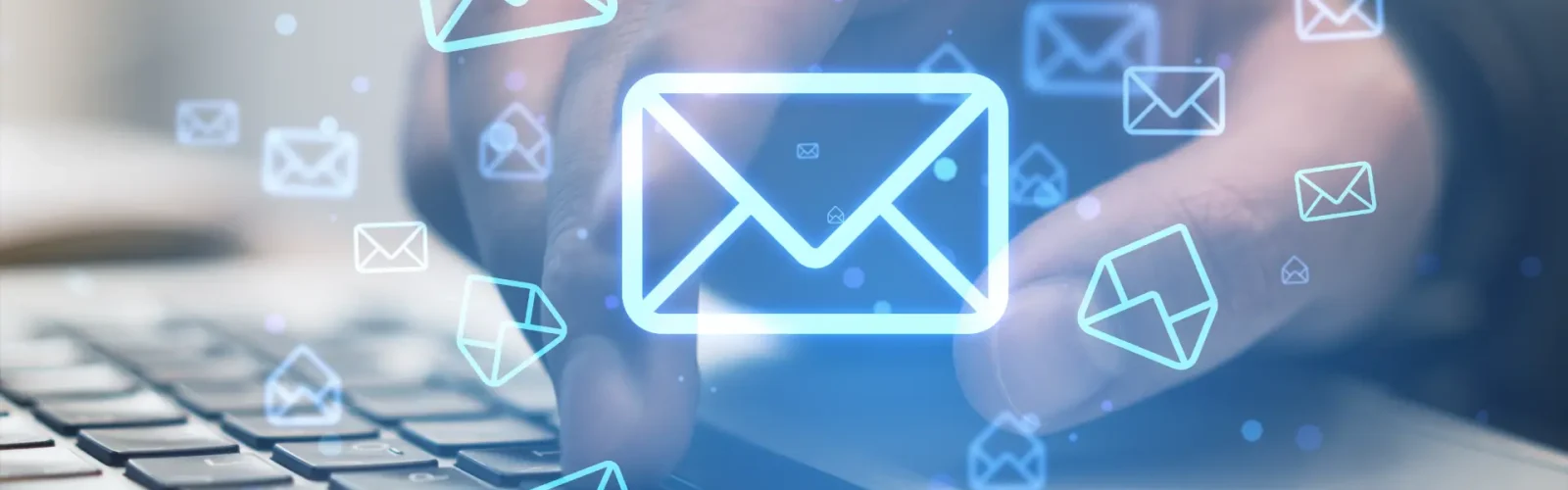 close-up-businessman-hands-using-laptop-keyboard-desk-with-glowing-email-letter-icons-blurry-background-communication-business-message-concept